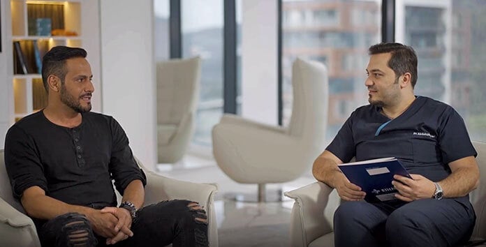 Patient Rawderson discussing his hair transplant experience and result with Dr. Balwi
