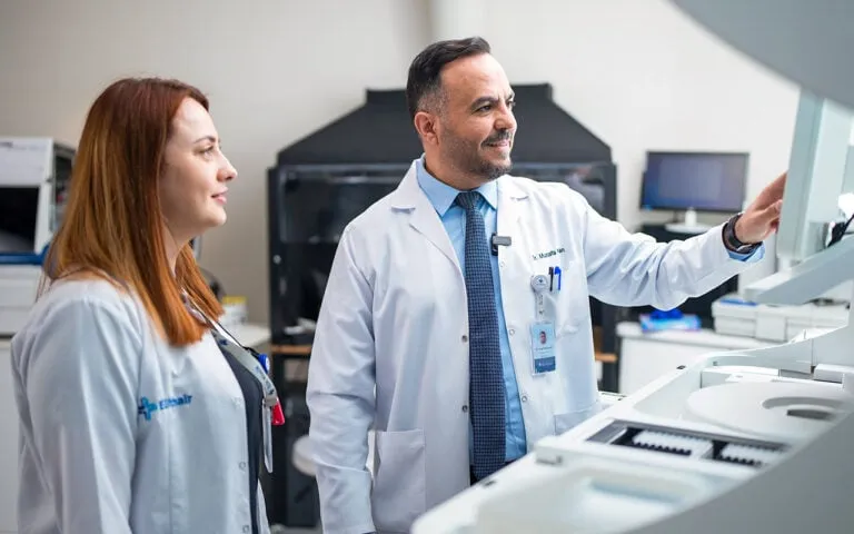 Interior of Elit Clinic research laboratory showing modern equipment and medical staff conducting hair transplant research