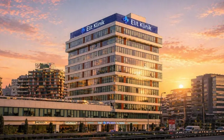 Exterior view of Elit Clinic in Istanbul at sunset with warm lighting highlighting the building facade